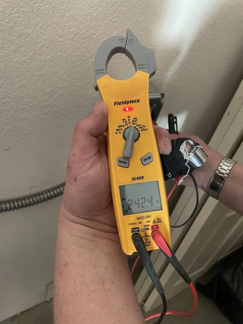Voltage testing with clamp meter during Electrical Installation Services in Goshen